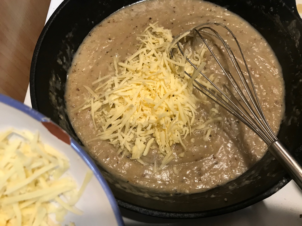 mixing the cheese into the roux