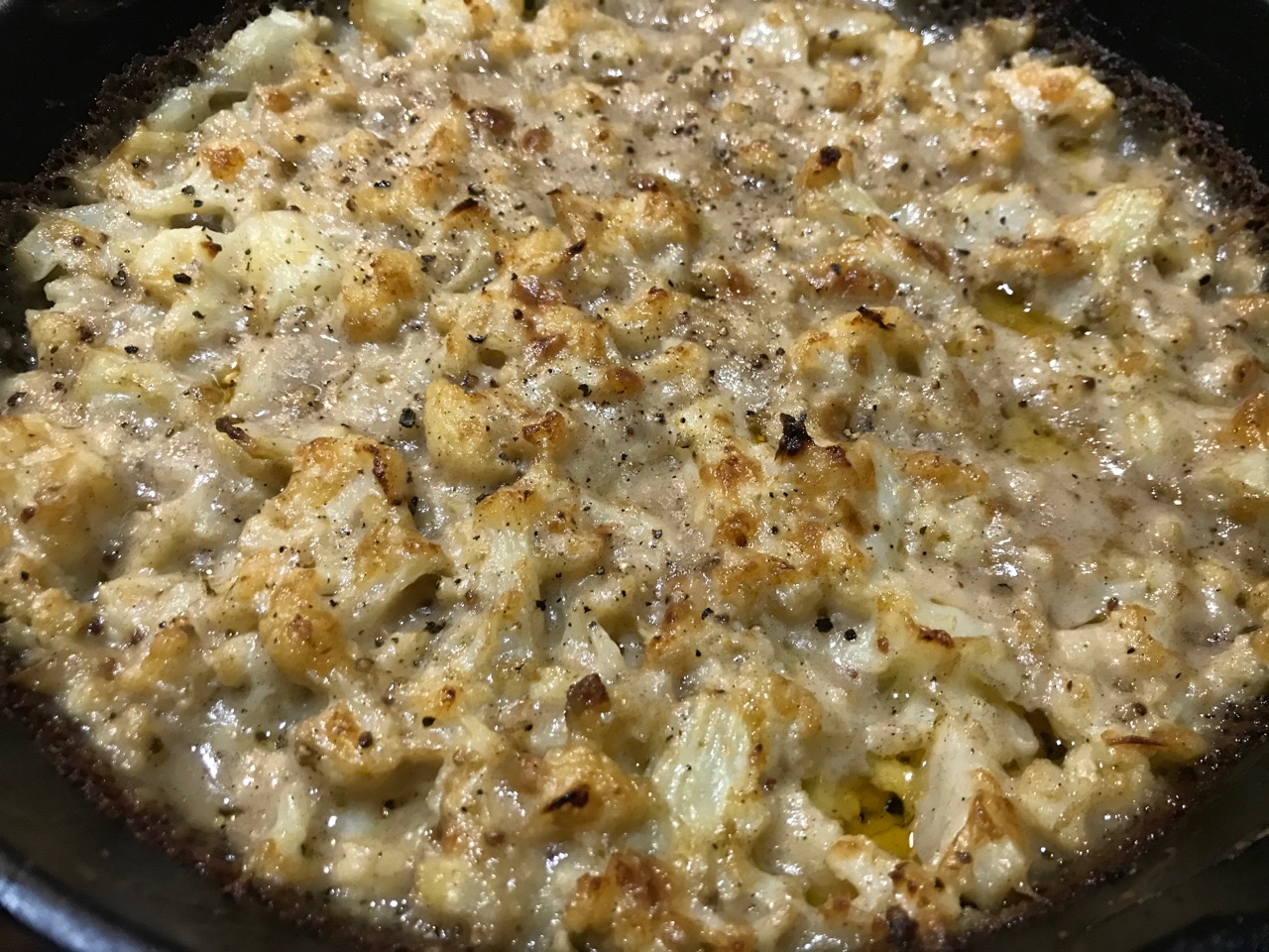 cauliflower cheese in the cast iron after baking