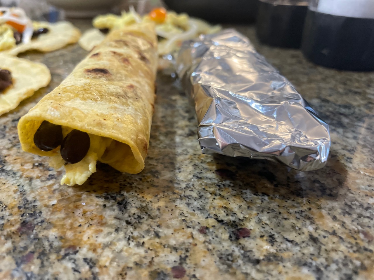 side angle of rolled taquito and one in foil
