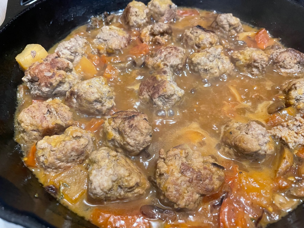 meatballs in the pan cooking in the sauce